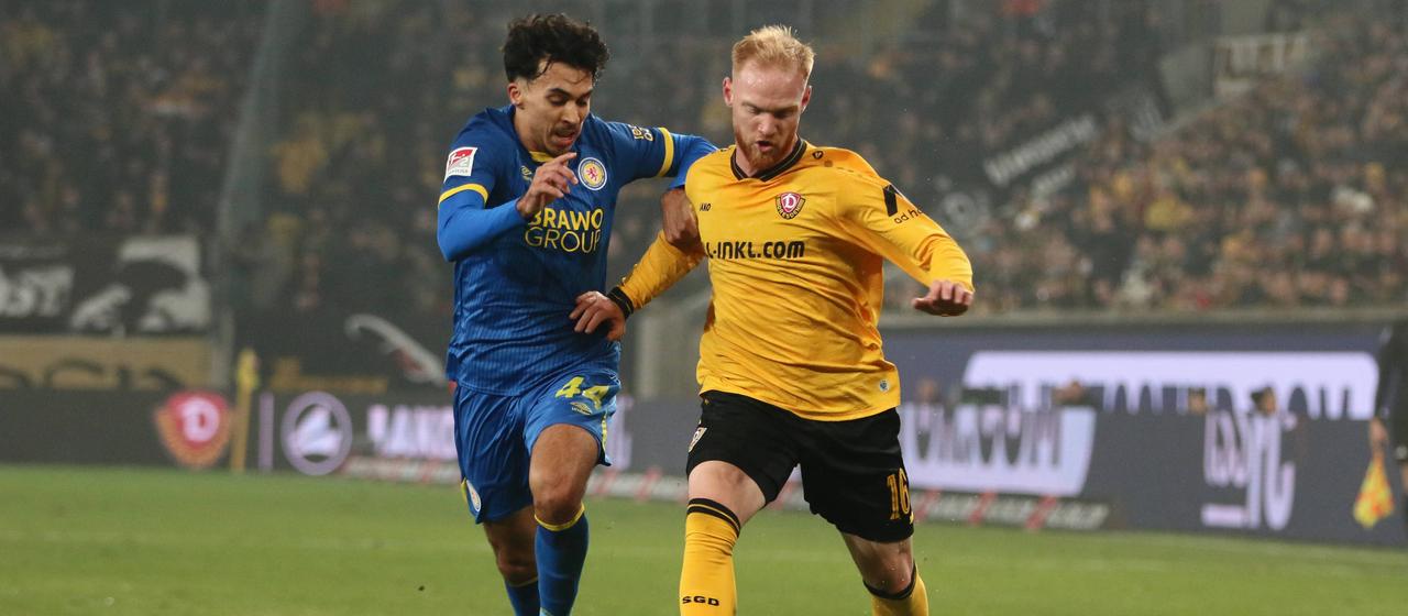 Braunschweig's Johan Gomez in a duel with Dresden's Nils Froling