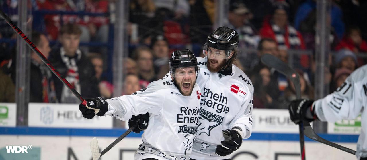 Cologne's Tuomie (l) and Macinnis celebrate together after scoring a goal