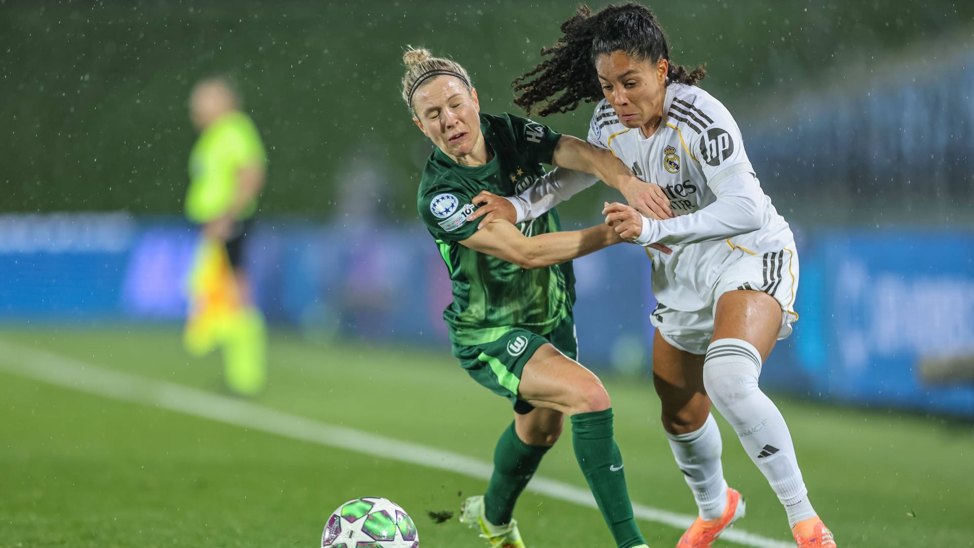 Tough duel: Wolfsburg's Huth (left) with Real's Yasmim.
