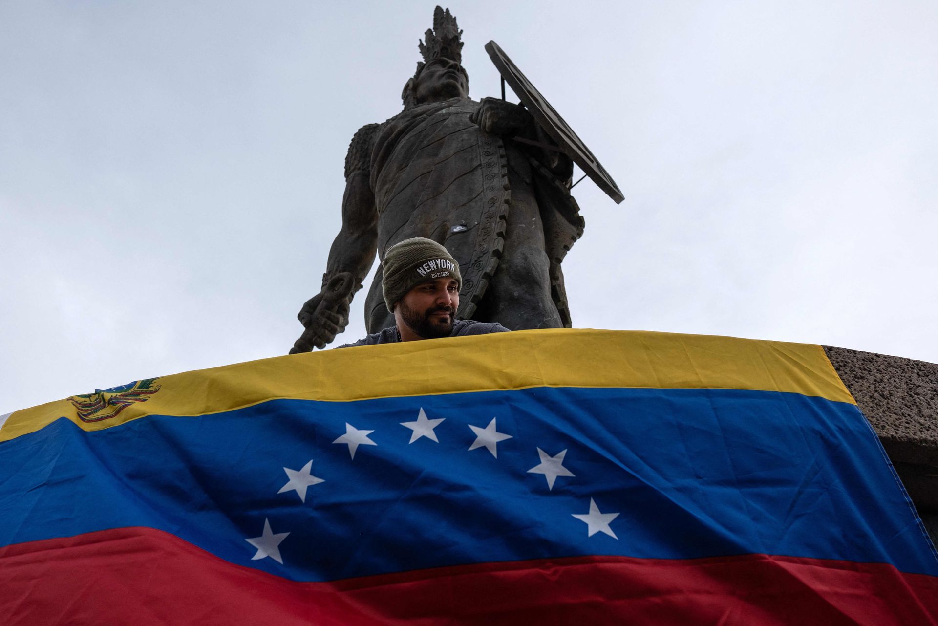 Venezuelan Adrian Graterol, who has lived in Mexico for four years, celebrates the capture of Nicolás Maduro by the US on Saturday at the Cuauhtemoc monument in Tijuana, Mexico.