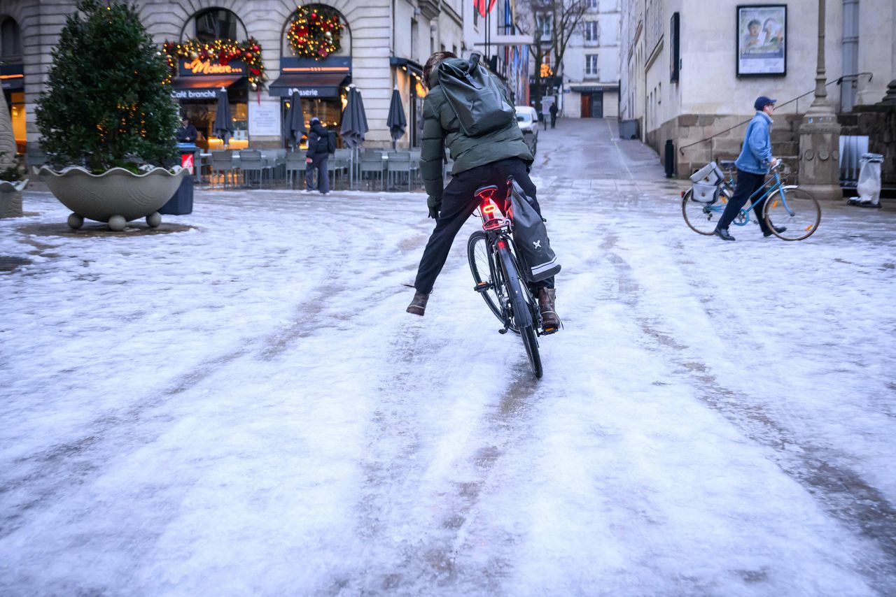 A cyclist braves the snow in Nantes in western France.