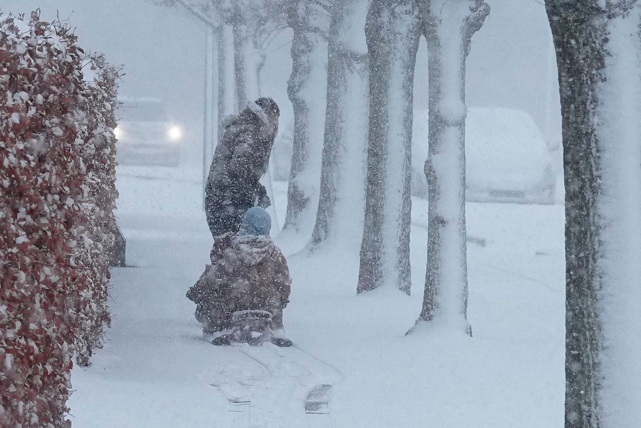 A child sits on a sled in Aalborg, Denmark, on January 2.