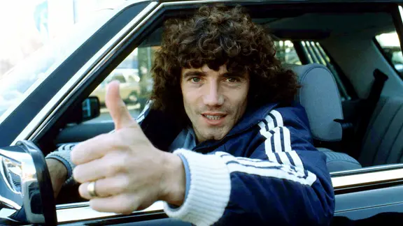 Kevin Keegan behind the wheel of his car.
