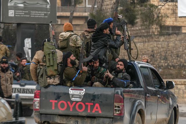 An armed patrol in Aleppo last Wednesday.