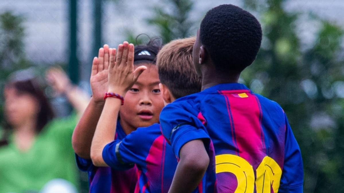 Shinta celebrates a goal with his U-12 teammates
