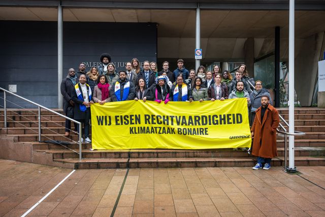 Greenpeace plaintiffs outside the court prior to the ruling. 