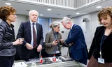 Outgoing State Secretary Eric van der Burg (VVD, Justice and Security) (right) in conversation with the VVD faction during the discussion of the dispersal law by the Senate.