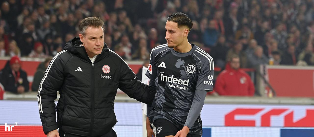Younes Ebnoutalib holds his injured knee.