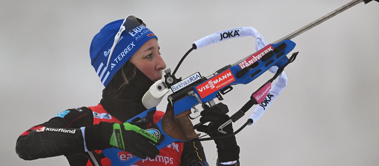 The biathlete Franziska Preuß (Germany) at the shooting range.