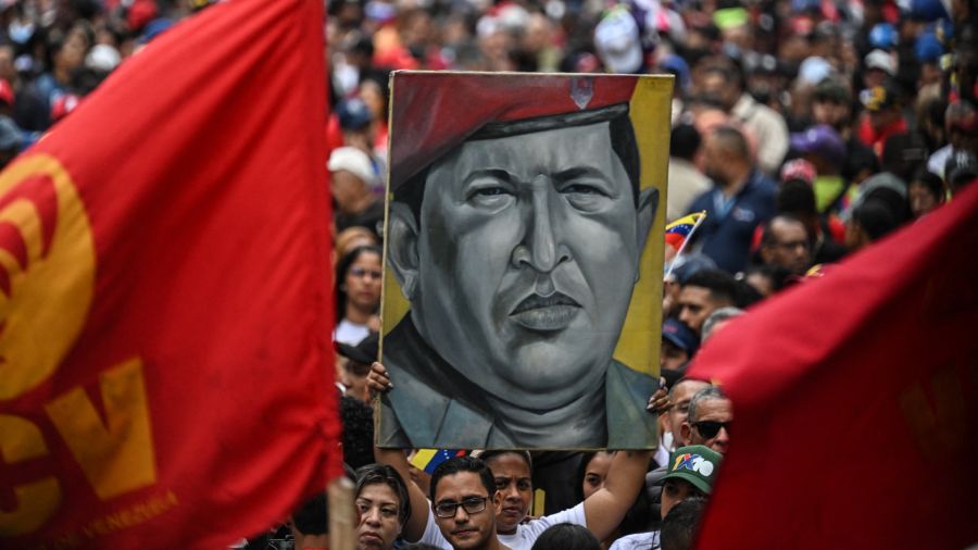Photogallery Supporters of Venezuelan President Nicolás Maduro hold a painting of the late President Hugo Chávez during a demonstration in Caracas