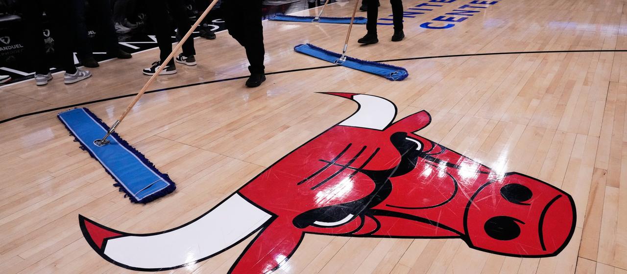 United Center employees try to dry the field