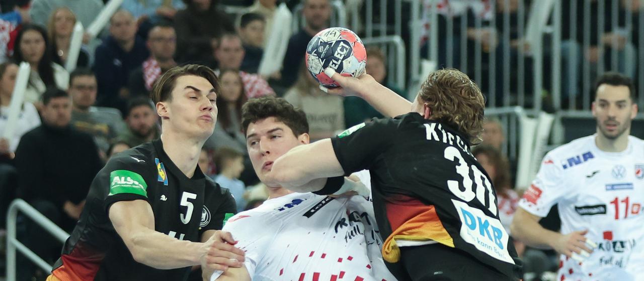 Croatia's Lovre Klarica in a duel with Germany's Tom Kiesler and Miro Schluroff