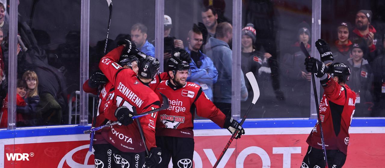 The Kölner Haie players celebrate their goal