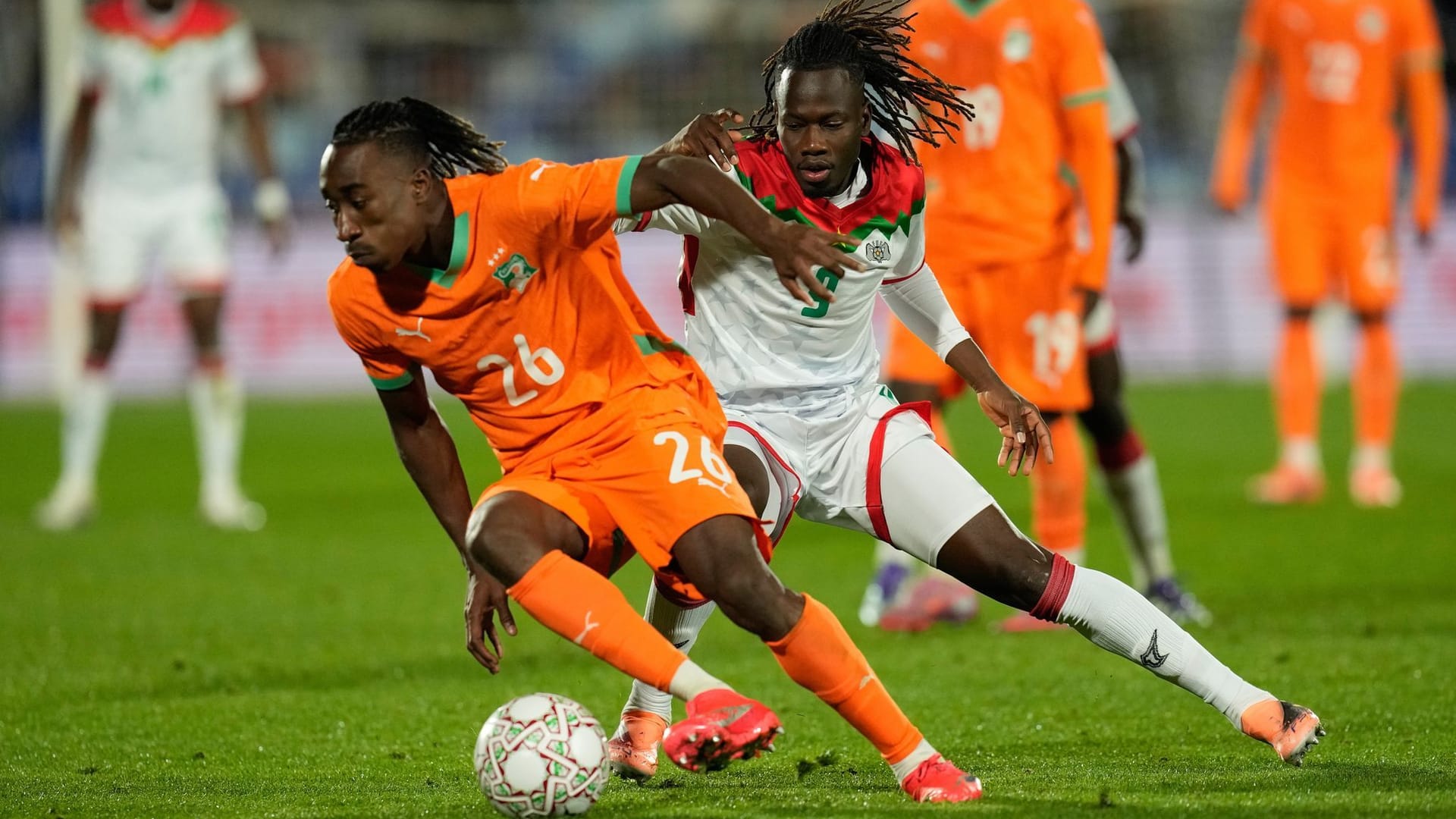 Left behind: Ivory Coast attacker Yan Diomande (left) in front of Burkina Faso's Issa Kaboré.