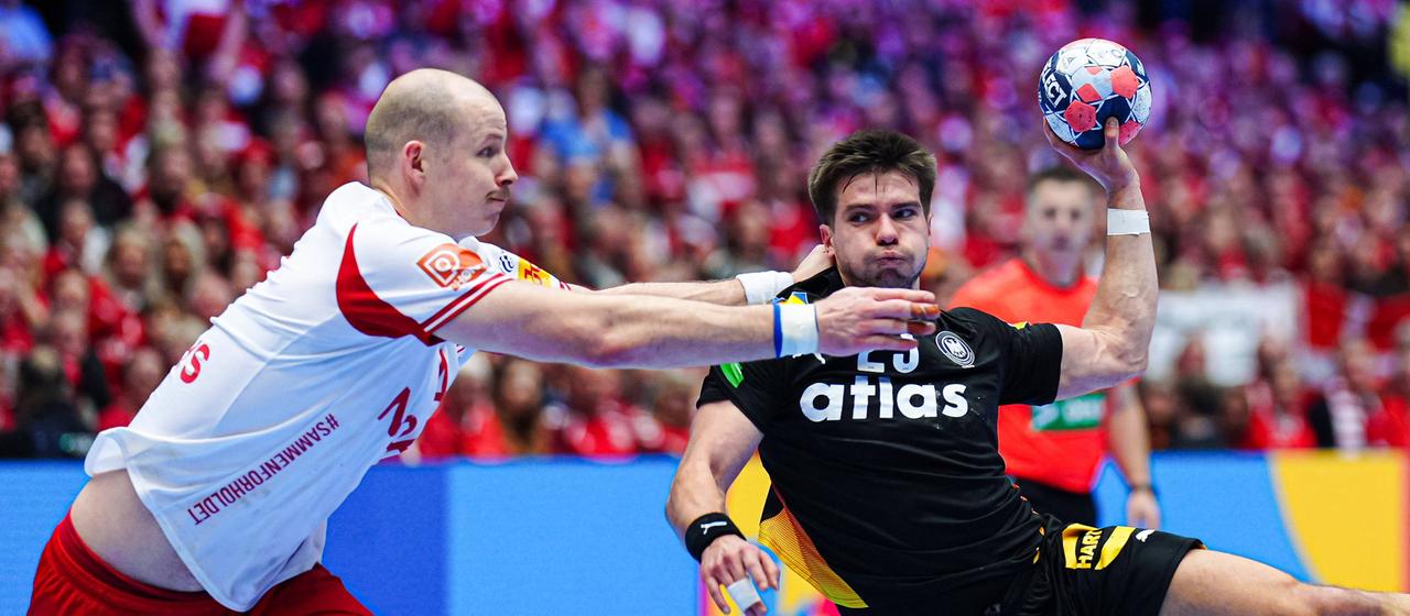 Renars Uscins throws at Denmark's goal