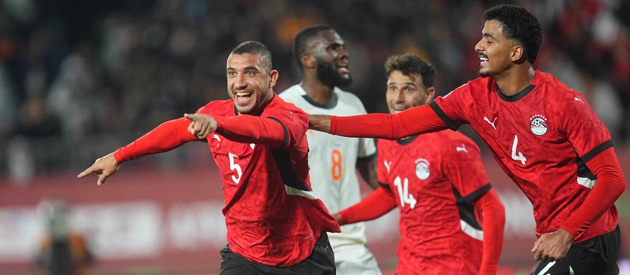The Egyptians around goal scorer Rami Rabia (from left), Hossam Abdelmaguid (from right) and Hamdy Fathy (2nd from right) celebrate their team's second goal