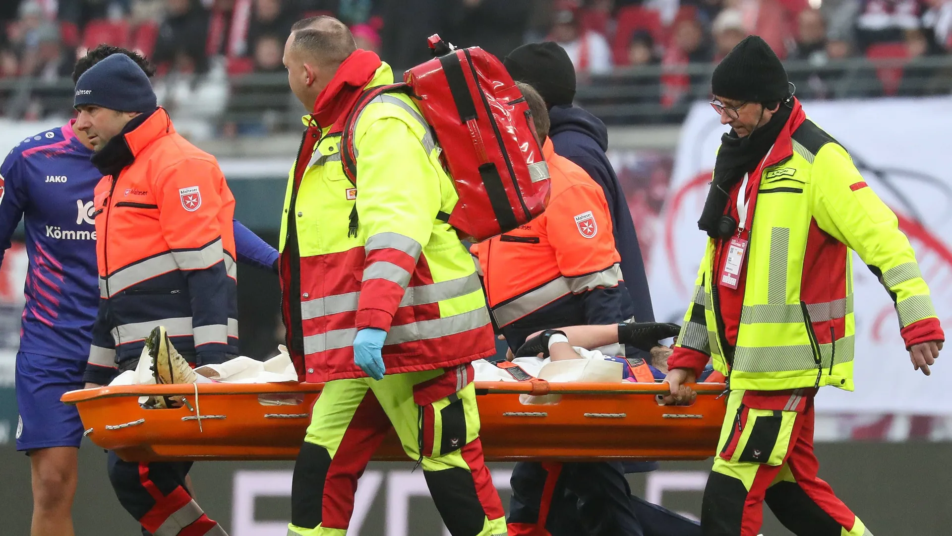 Bitter farewell: Benedict Hollerbach is carried off the pitch in Leipzig. Bitter farewell: Benedict Hollerbach is carried off the pitch in Leipzig.