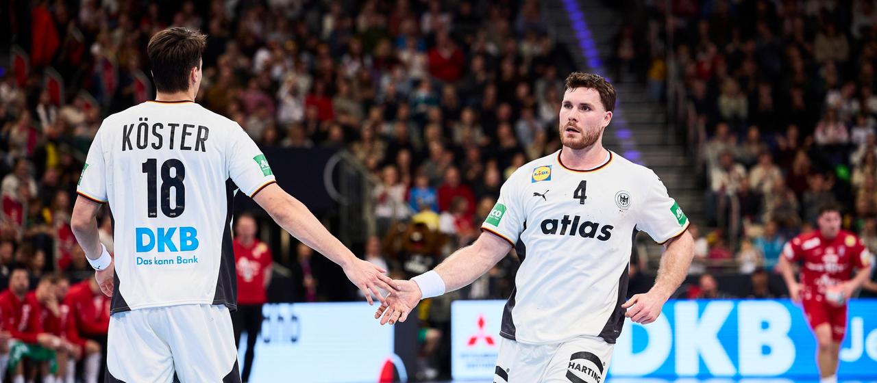 Germany's Johannes Golla and Julian Köster fight off