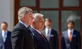 Robert Fico (l), Prime Minister of Slovakia, and Viktor Orbán, Prime Minister of Hungary, inspect a guard of honor during a meeting in Bratislava, April 2025. 