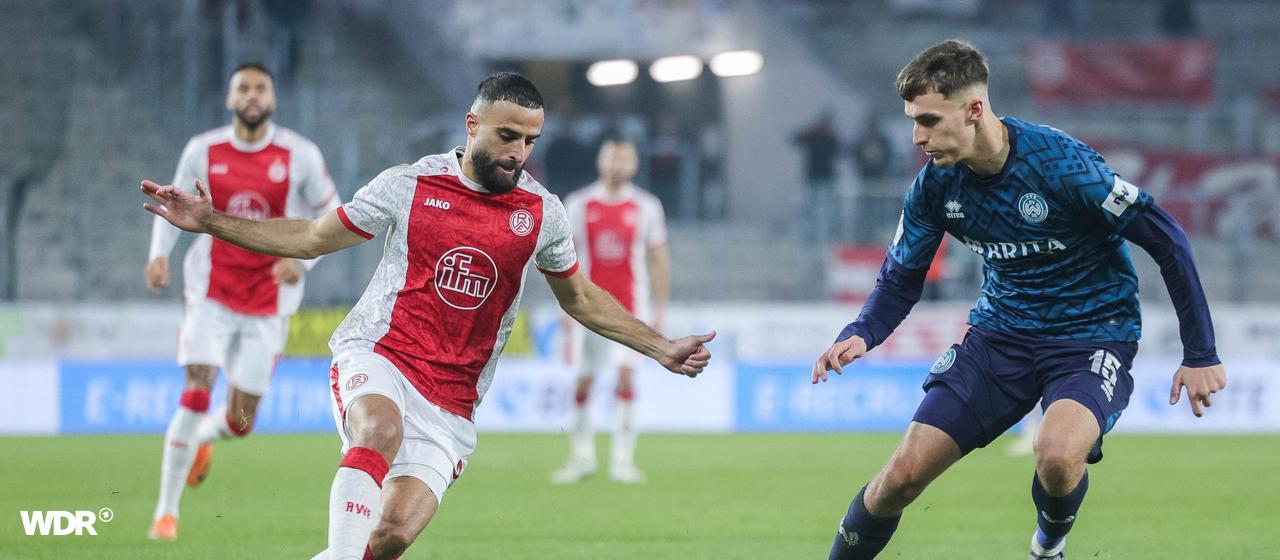 Essen's Ramien Safi on the ball against Justin Janitzek from Wehen Wiesbaden