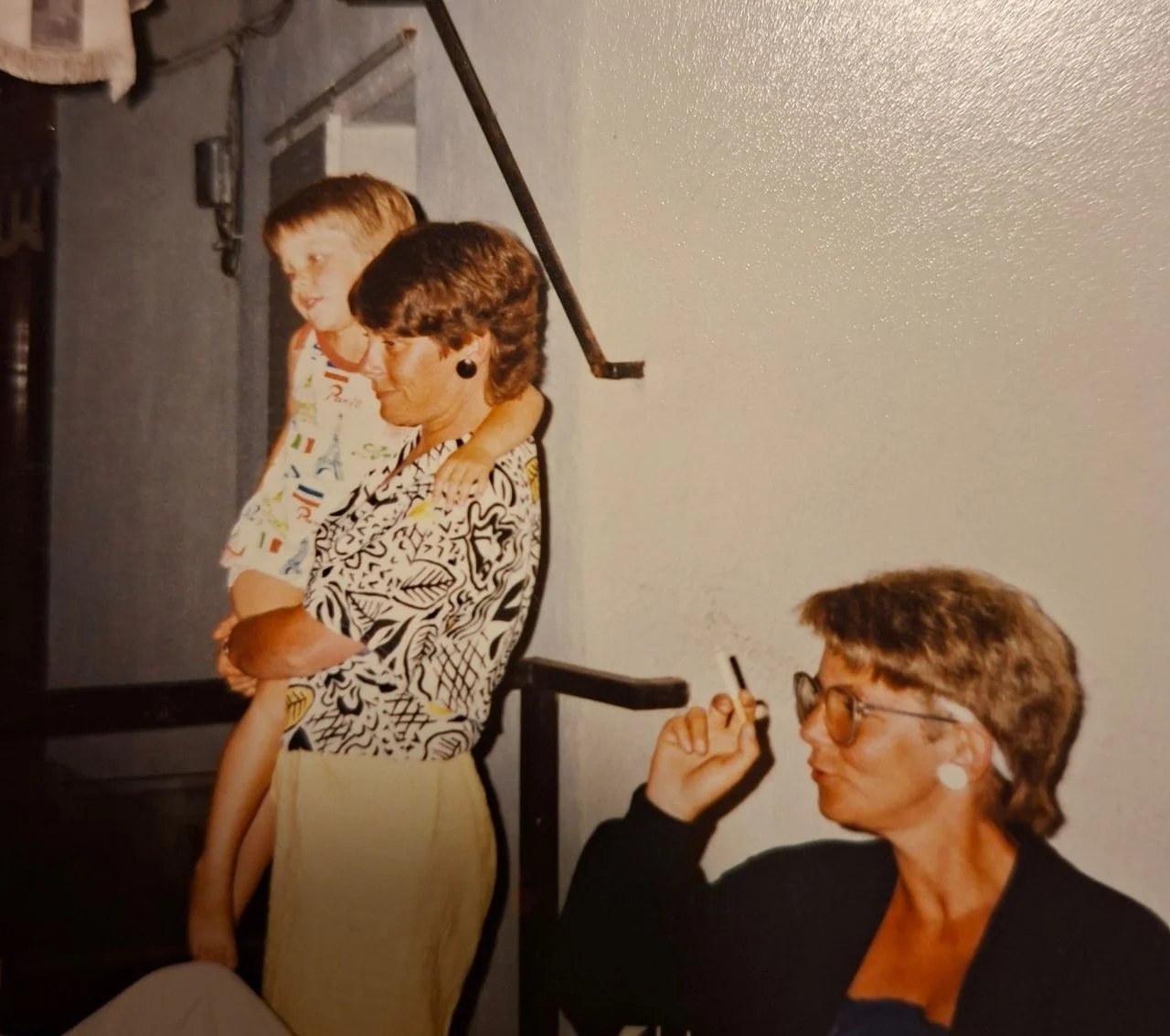 Maaike as a little girl in her aunt's arms.