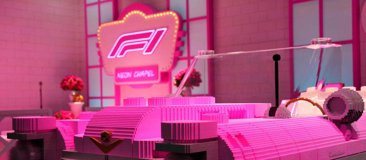 A Cadillac car made from Lego in front of the Grand Prix in Las Vegas