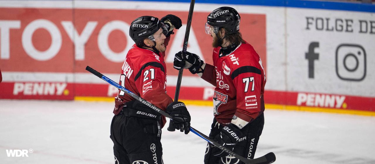 Juhani Tyrväinen and Ryan Macinnis celebrate