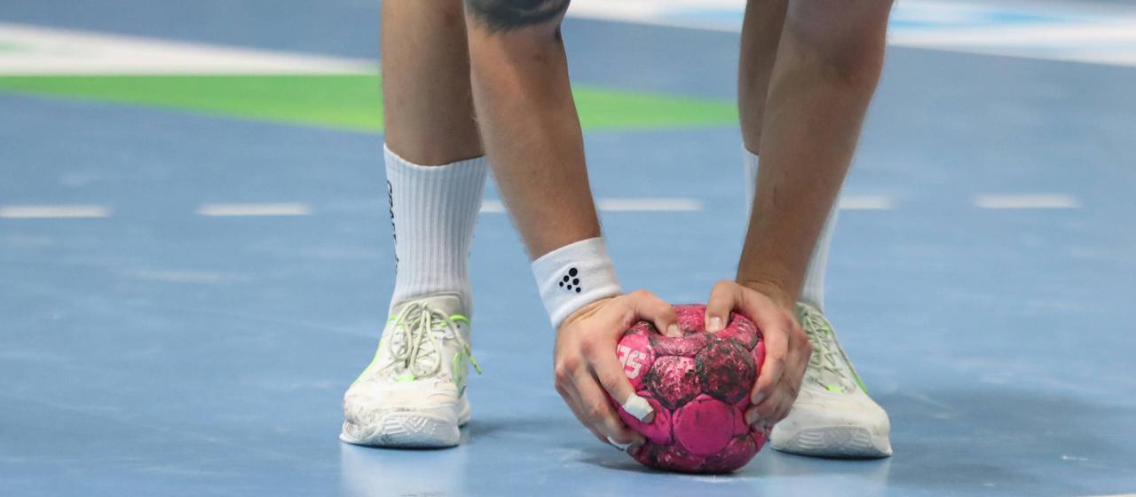 A handball player with a ball