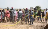 Nigerian police set up a cordon around the site of the US airstrike in northwestern Nigeria. 