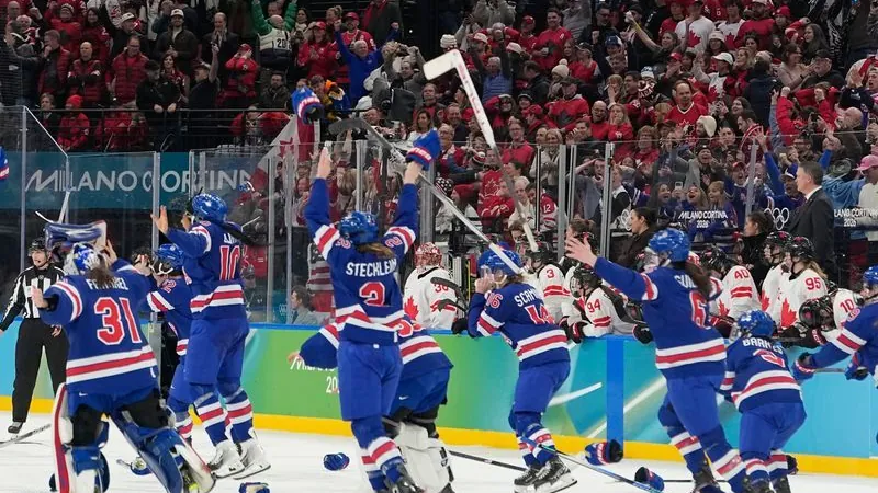 Winter Olympics: USA players celebrate after scoring the winning goal.