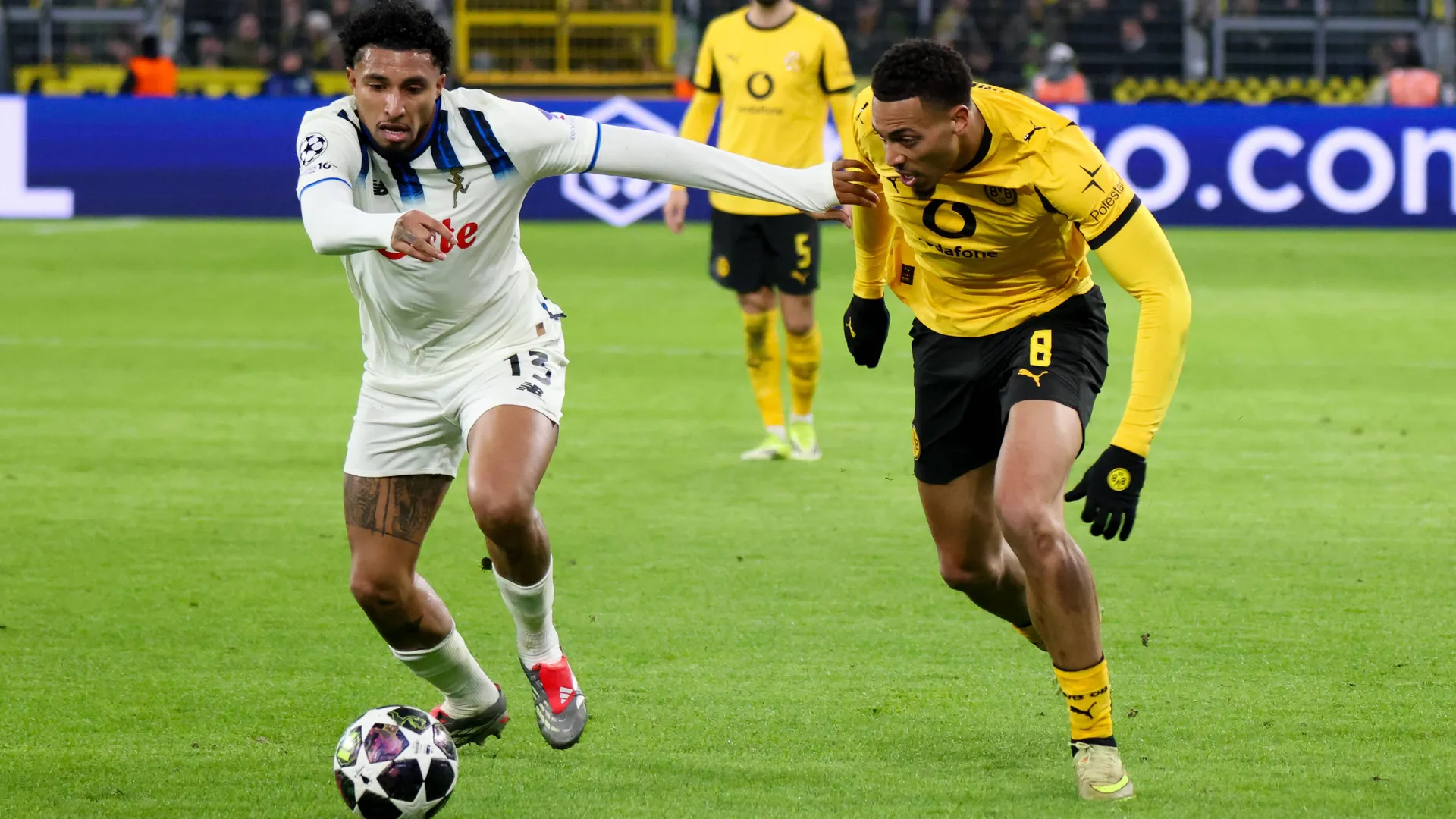 Scene from the first leg: Bergamo's Ederson (left) against Dortmund's Nmecha.
