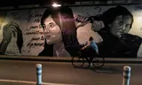 A mural in Paris, with the image of Mahsa Amini on the left, shows solidarity with the ongoing protests in Iran.