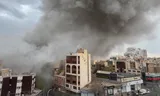 Plumes of smoke from two air strikes rose over the Iranian capital Tehran on Monday.