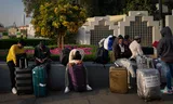 Stranded passengers wait at Dubai's closed international airport.