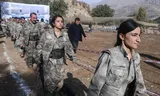 PKK fighters who withdrew from Turkey attend a meeting in northern Iraq. 