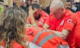 Volunteers from the Lebanese Red Cross stand by the coffin of their colleague, paramedic Youssef Assaf, during his funeral in the southern Lebanese city of Tyre, on Wednesday, March 11. Assaf was killed in an Israeli attack.