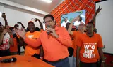 Chan Santokhi of the VHP celebrates the seat win in the party center in Paramaribo.