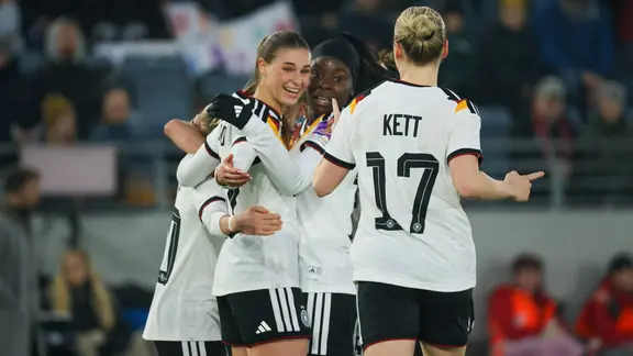 Germany's footballers cheer after Jule Brand (2nd from left) scored to make it 4-0 in Norway