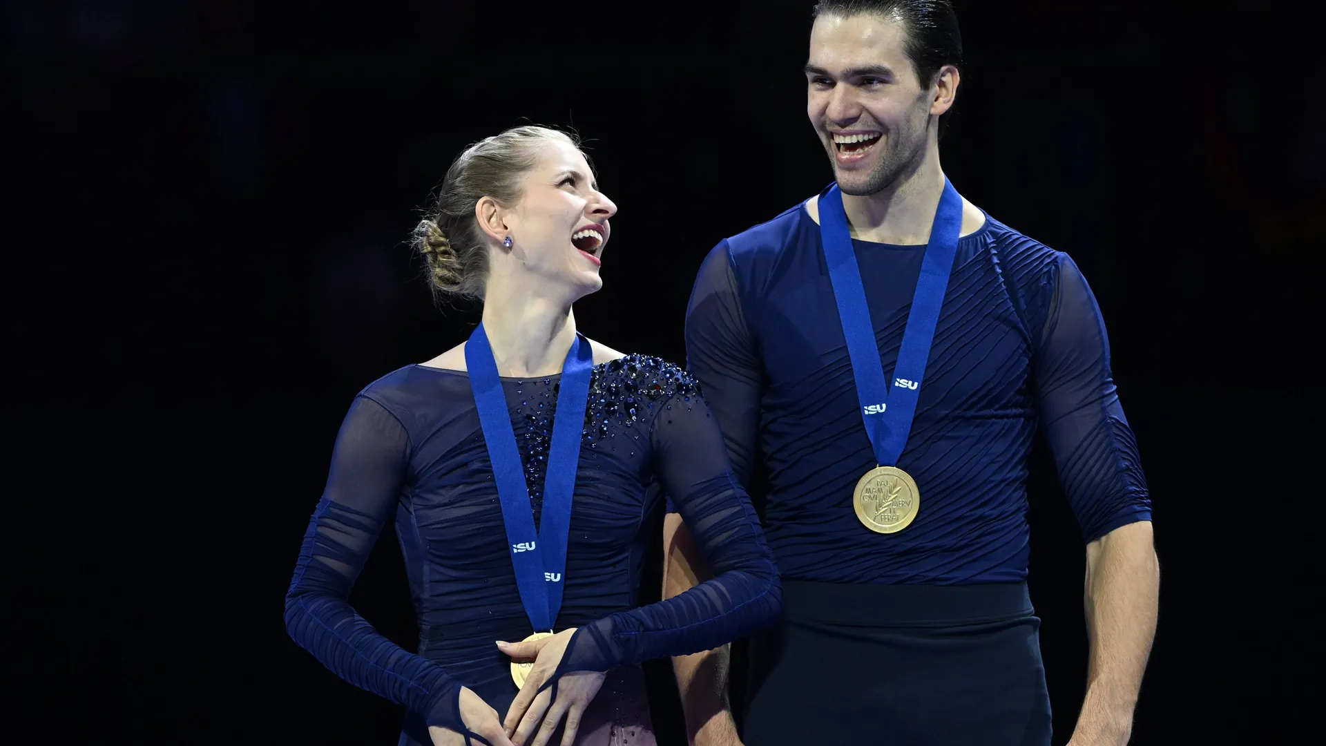 Overjoyed: Minerva Hase and Nikita Volodin with their World Cup gold medals. Overjoyed: Minerva Hase and Nikita Volodin with their World Cup gold medals.
