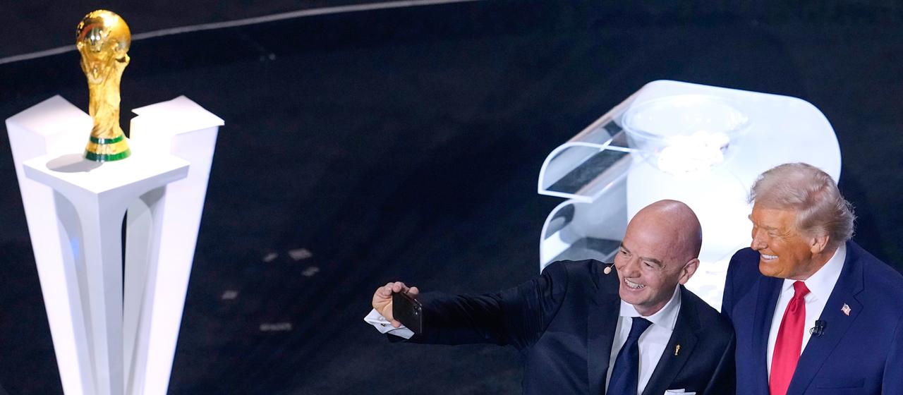 Gianni Infantino takes a selfie with Donald Trump