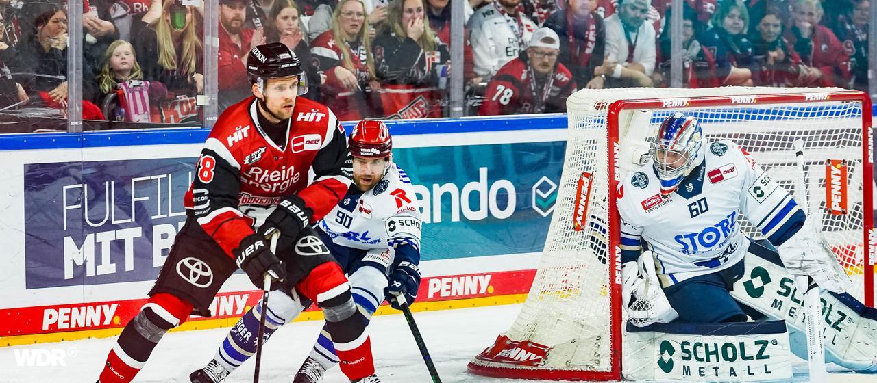 Cologne's Dominik Bokk attacks Joacim Eriksson's Schwenniger goal
