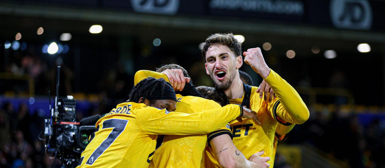 Wolverhampton players celebrate victory against Liverpool FC