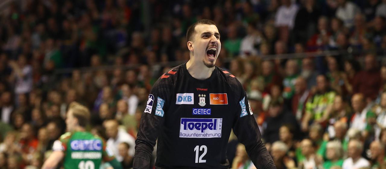 Magdeburg's Matej Mandic celebrates a saved ball