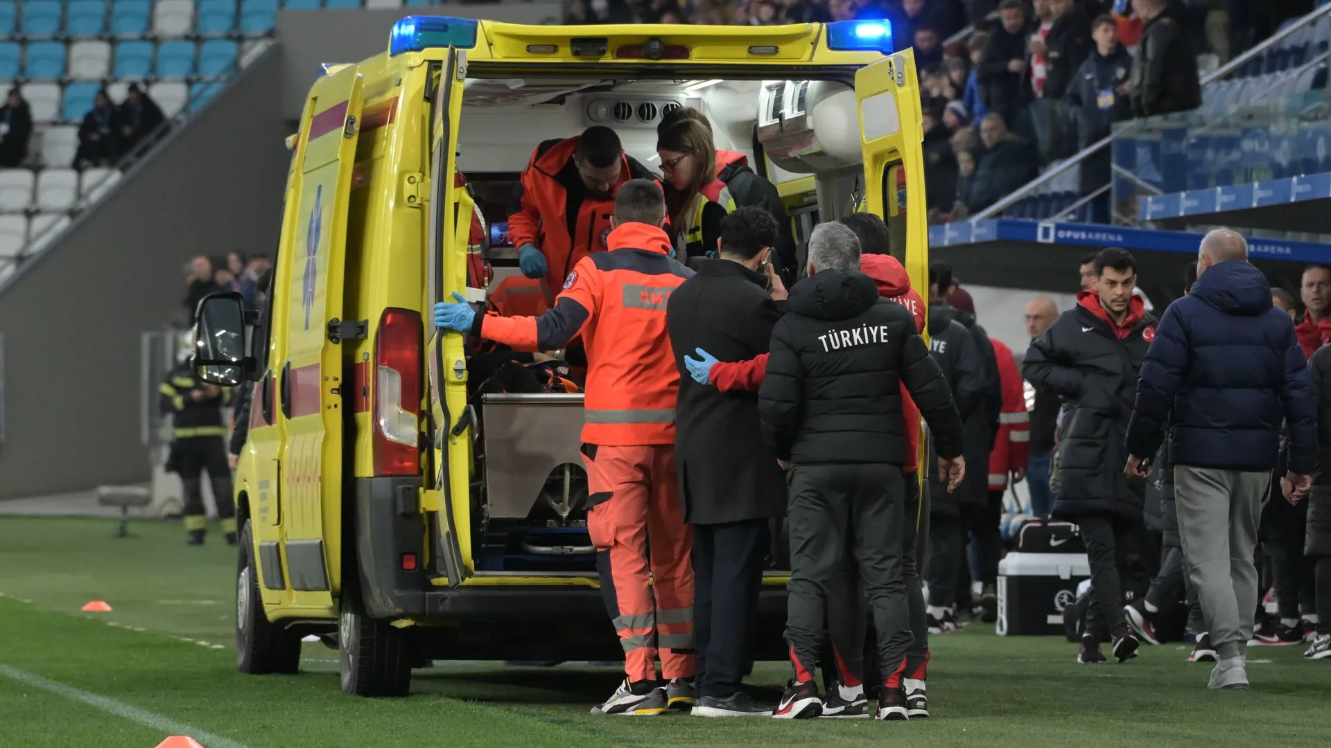 Shocking moment: Turkey coach Korkmaz is transported away in an ambulance. Shocking moment: Turkey coach Korkmaz is transported away in an ambulance.