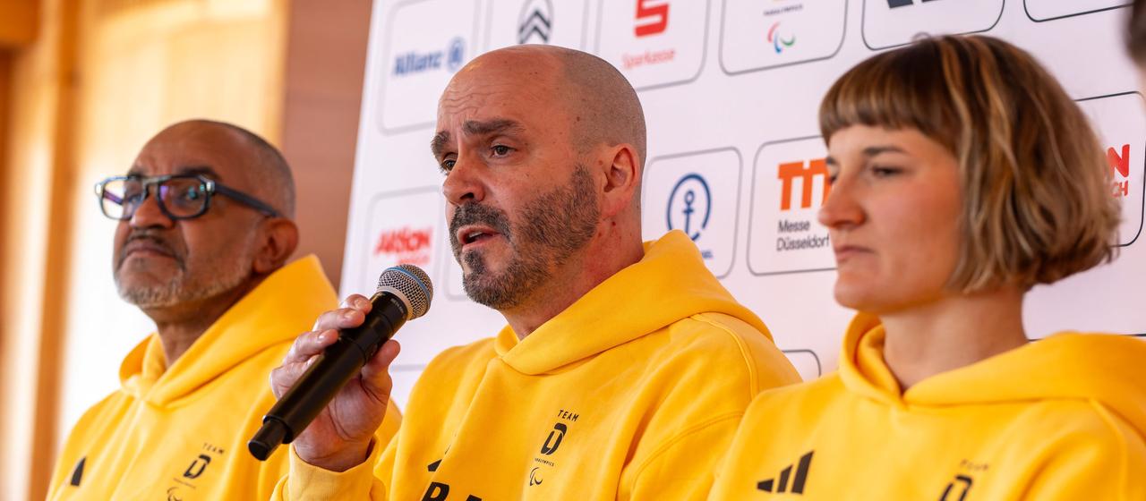 Idriss Gonschinska (lr), CEO of the German Disabled Sports Association (DBS), Marc Möllmann, Chef de Mission of the German Disabled Sports Association (DBS), and Anna-Lena Forster, Paralympic athlete, sit during a press conference in the German House