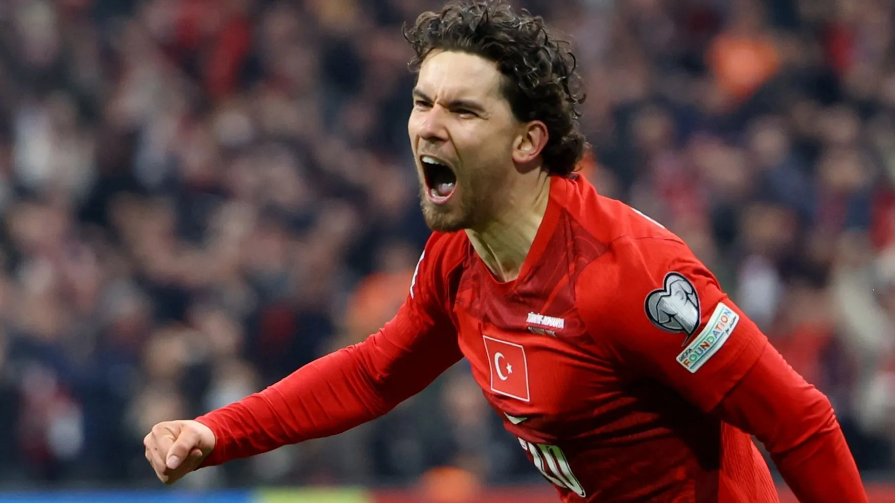 Match winner: Ferdi Kadioglu celebrates his goal for Turkey.