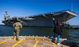 The American aircraft carrier USS George HW Bush departs from its home port of Norfolk in Virginia, probably on its way to the Middle East. 