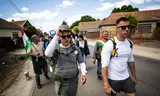 Hungarian opposition leader Peter Magyar (left) with supporters on his way to the Romanian city of Oradea, where he walked from Budapest in May to win support from ethnic Hungarians in Romania. 