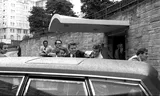 President Ronald Reagan is pushed into the presidential limousine by officers after being shot at the Hilton Hotel in Washington on March 30, 1981.