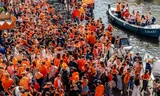 Crowds in the Amsterdam city center during King's Day 2025. 